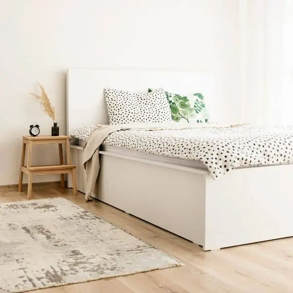 bedroom-23-ezgif.com-optiwebp bright bedroom with clean sheets