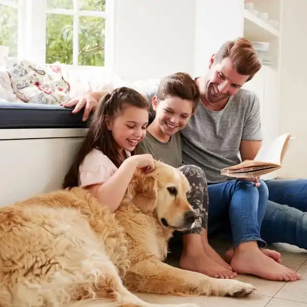 family-28-ezgif.com-optiwebp a family spending time with their dog